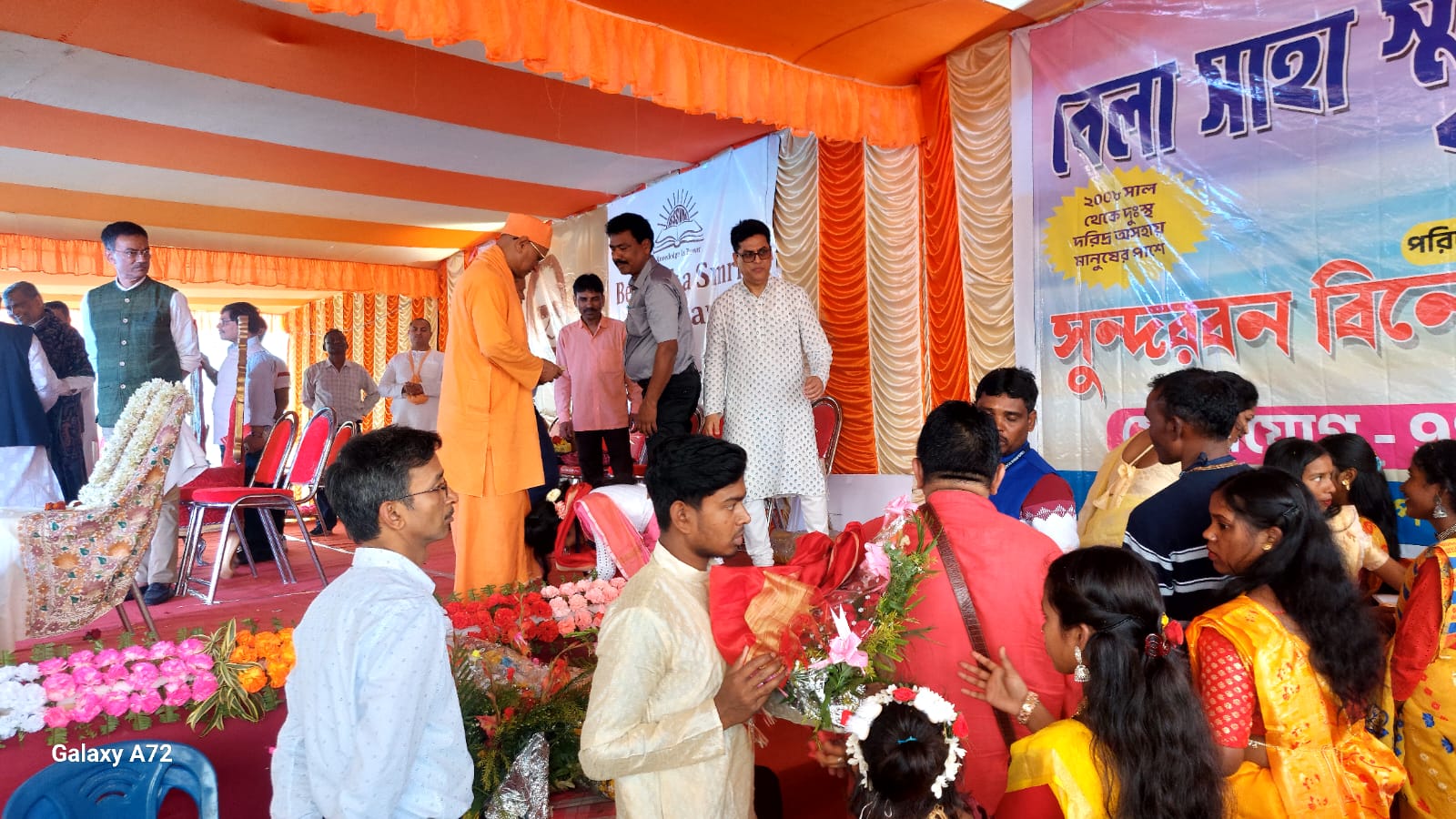 Community members gathered together at a local programme